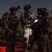 Coalition force members conduct operation in Helmand province