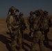 Coalition force members conduct operation in Helmand province