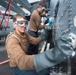 Washing an MH-60S Sea Hawk helicopter