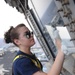 Airman cleans window