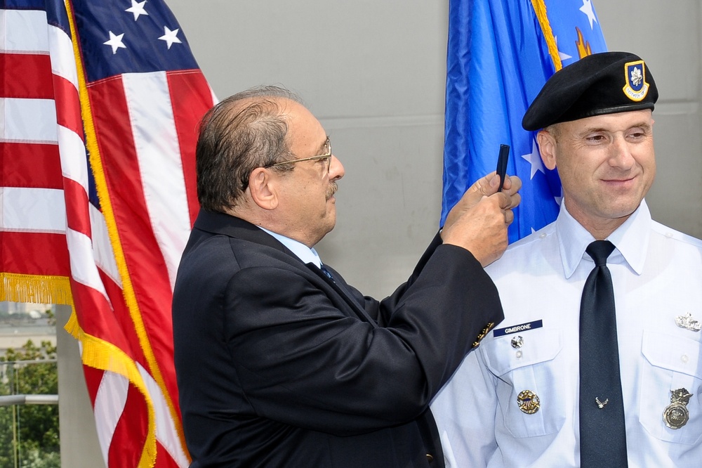 Air Force Lt. Col. Promotable Michael Gimbrone is promoted to the rank of Colonel by Air Force Brig. Gen. Allen J. Jamerson