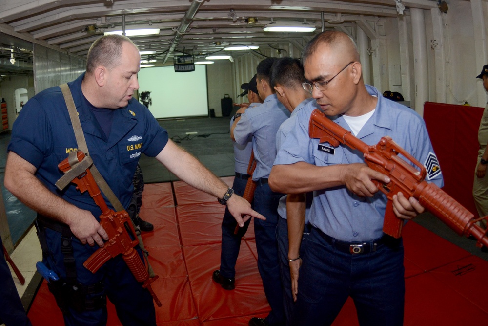 USS Emory S. Land sailors in Philippines