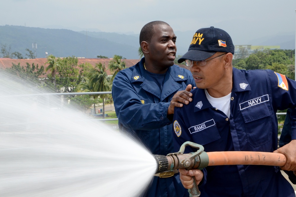 USS Emory S. Land sailors in Philippines