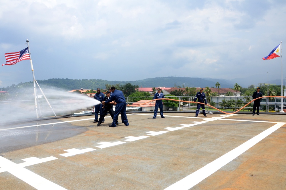 USS Emory S. Land sailors in Philippines