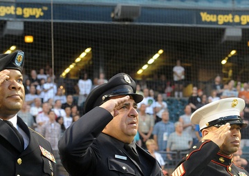 Honorees render a salute during Chicago White Sox 9/11 game