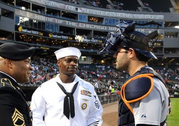 Service-members meet Detroit Tigers player during Chicago White Sox home game