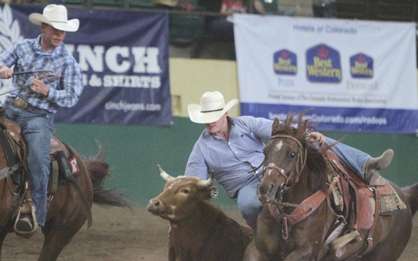 22 SOPS officer doubles as steer wrestler