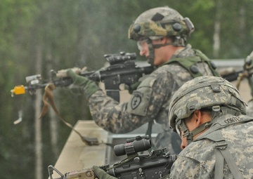 Spartan paratroopers and Arctic Wolves descend from the skies over JBER