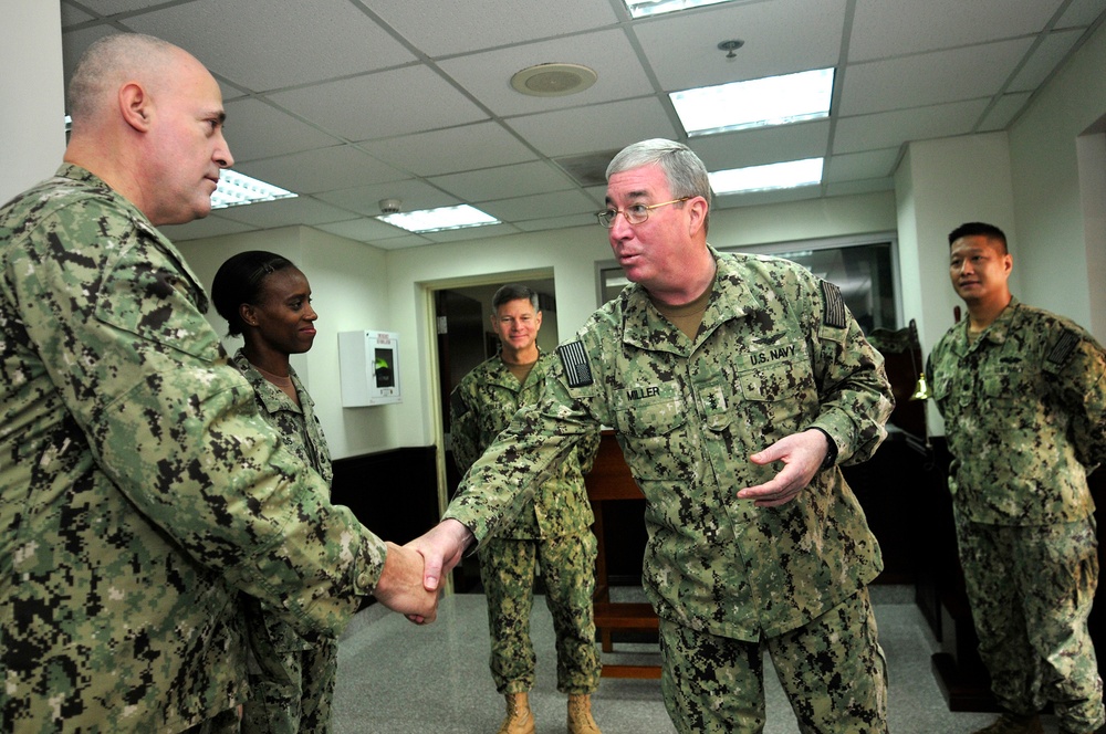 Vice Adm. Miller with sailors from NAVCENT's logistics and infrastructure department