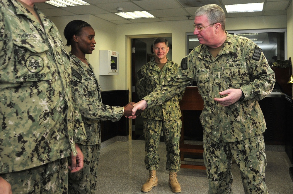 Vice Adm. Miller with sailors from NAVCENT's logistics and infrastructure department