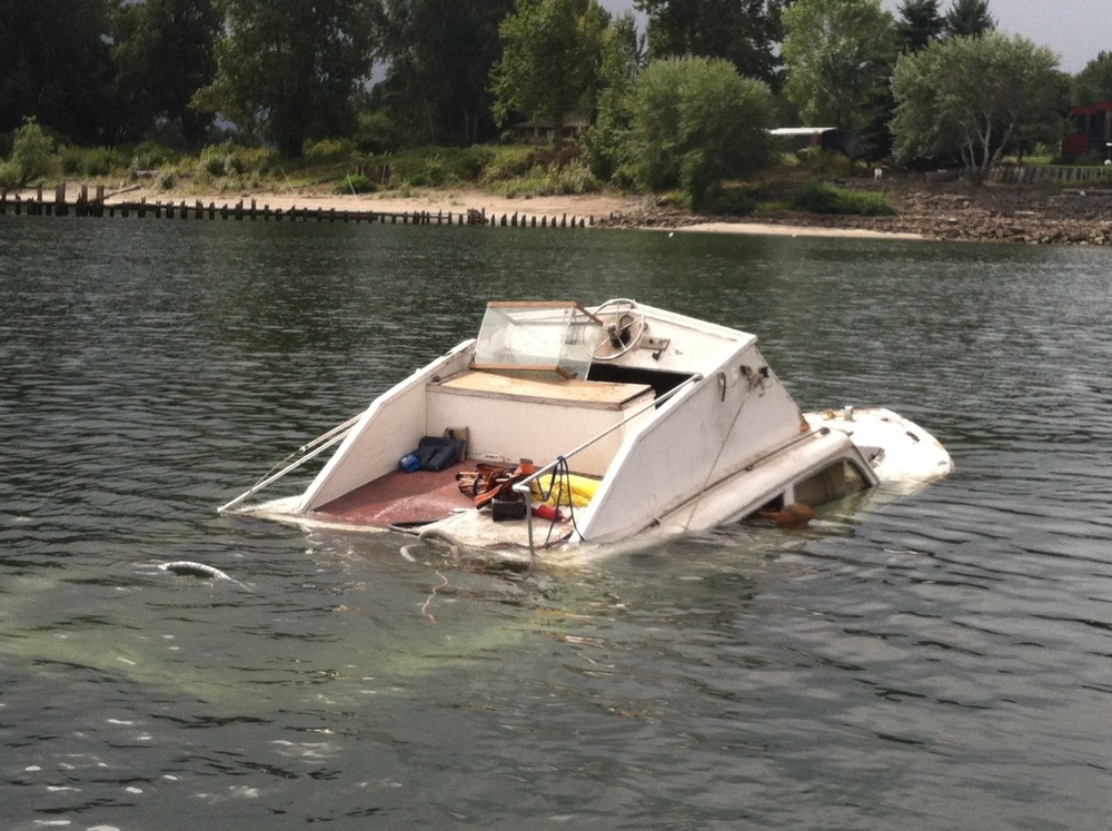 Partially sunken vessel