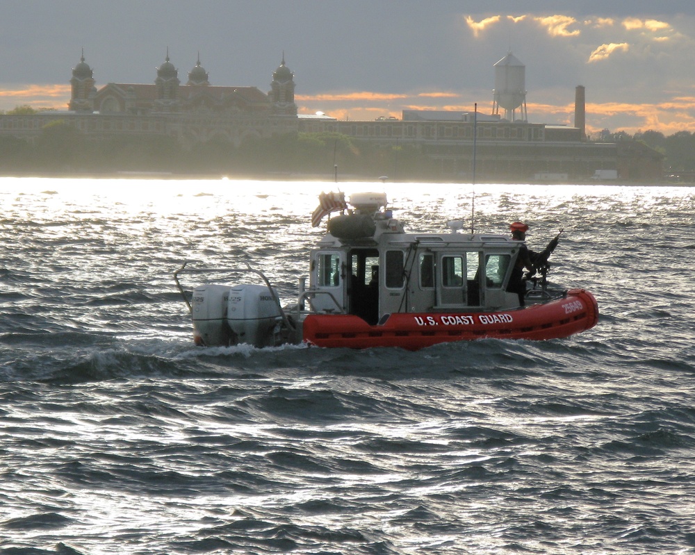 US Coast Guard small boat in New York Harbor at dusk