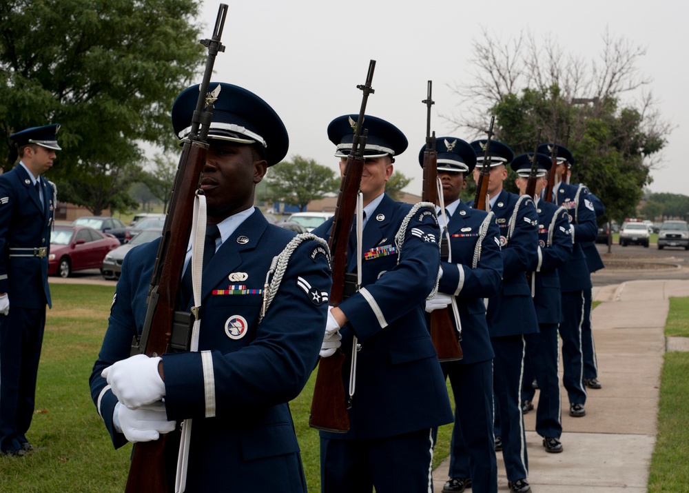 Base honor guard shows respects