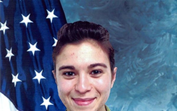 This is an official U.S. Air Force military portrait of a service member wearing OCP (Operational Camouflage Pattern) uniform. The name tape reads 'HOODY' and the branch tape reads 'U.S. AIR FORCE'. The subject is posed in front of an American flag against a blue studio backdrop, consistent with standard military ID or official portrait photography.