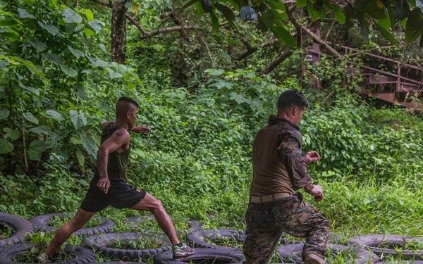 U.S. and Philippine Marines overcome jungle obstacles