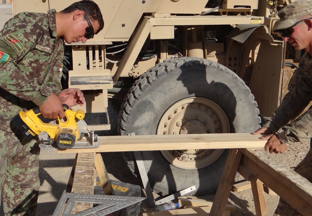 Afghan and US Army engineers and medical personnel collaborate to provide medical care