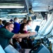 Guests tour the navigation bridge aboard the aircraft carrier USS Ronald Reagan (CVN 76)