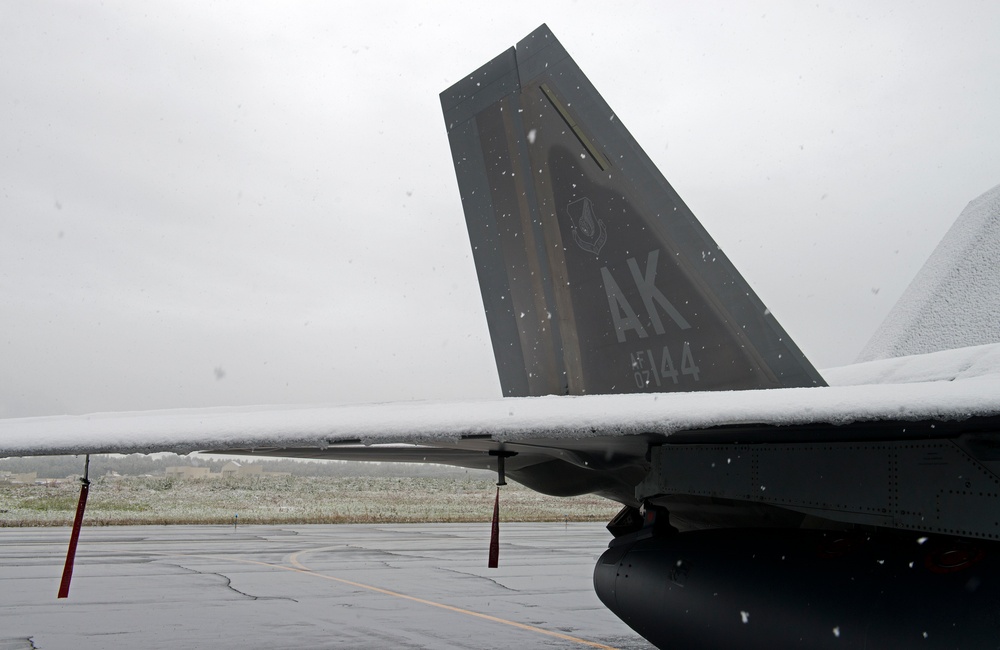 Snowfall on JBER covers F-22