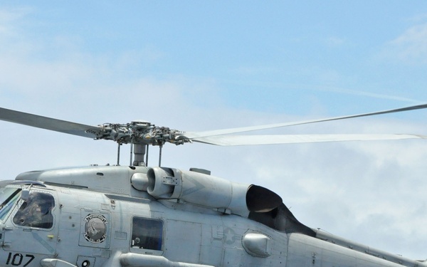 Helicopter takes off from USS Rentz