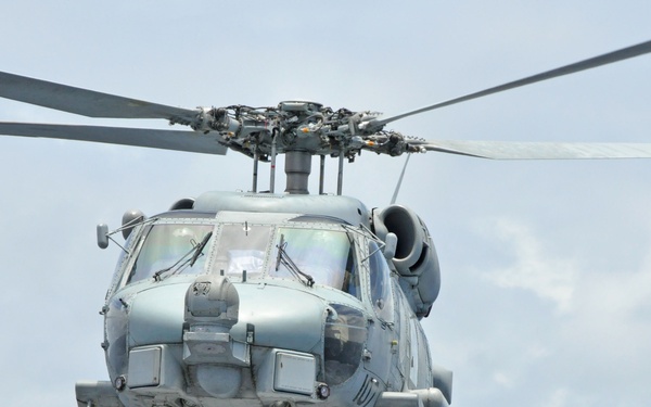 Helicopter takes off from USS Rentz