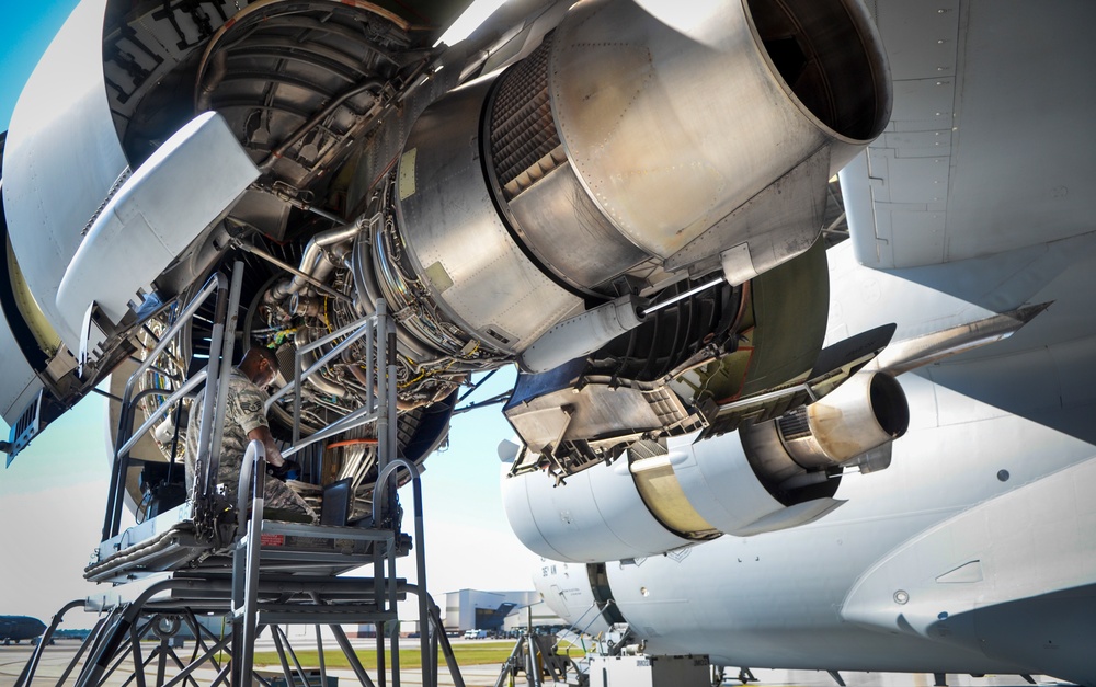 Under the hood.. airman inspects C-17 engine