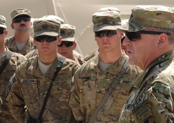 IJC commander visits ‘Black Jack,’ reenlists, coins Soldiers