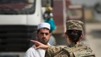 Tech. Sgt. Christina Peckat, 19th Movement Control Team surface movement Airman, coordinates trucker traffic with Abdul Basir, a parking attendant, at Forward Operating Base Salerno, Khost province, Afghanistan, Sept. 22, 2013. The 19th MCT, a small squadron of Air Force surface movement controllers and aerial porters, have the herculean task of overseeing the vast majority of retrograde operations at FOB Salerno. Peckat, a Denver, Colo. native, is deployed from RAF Mildenhall, England.
(USAF Photo/Master Sgt. Ben Bloker)