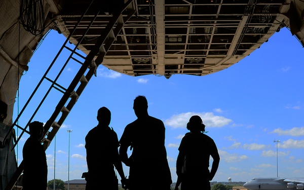 The 433 AMS and 356 AS work together to load a C-5A Galaxy
