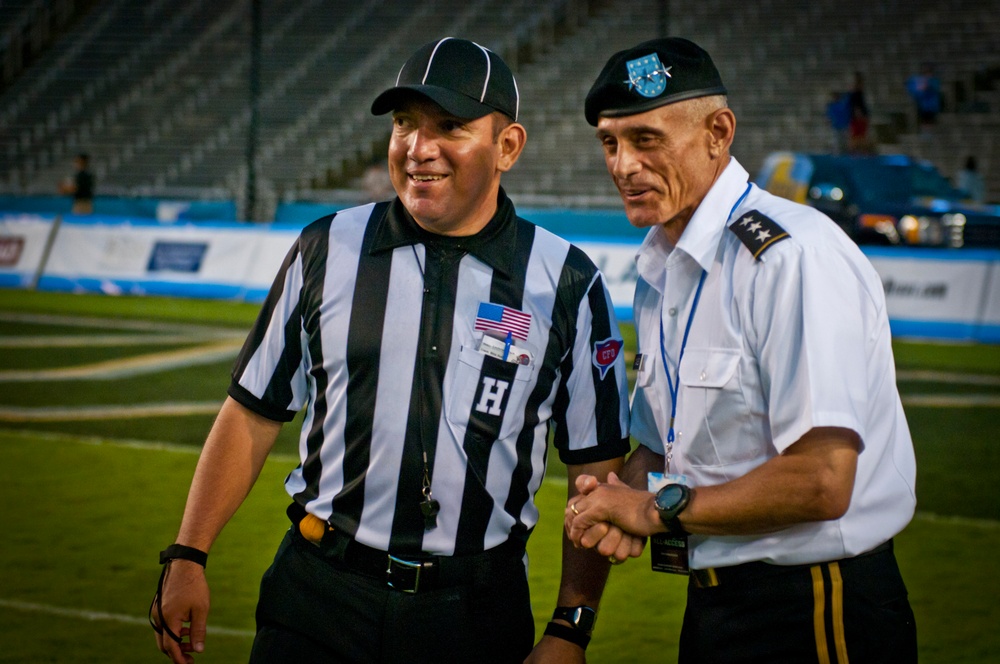 Lt. Gen. Robert L. Caslen Jr. discusses a call with a referee at Cotton Bowl Stadium