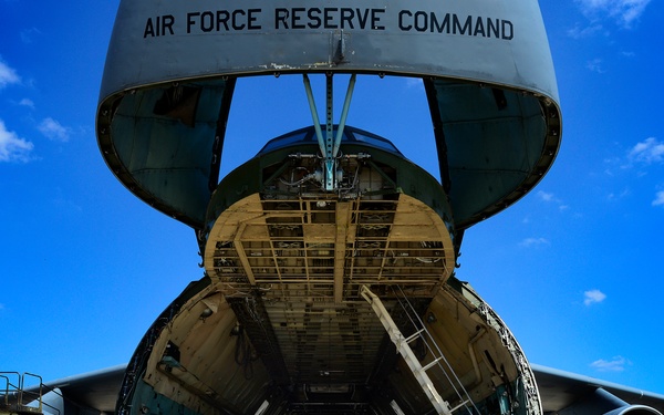 The 433 AMS and 356 AS work together to load a C-5A Galaxy