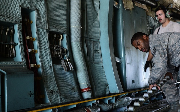 The 433 AMS and 356 AS work together to load a C-5A Galaxy