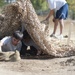 Service members get dirty for a good cause