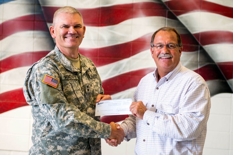 Local business presents donation to ND National Guard Emergency Relief Fund