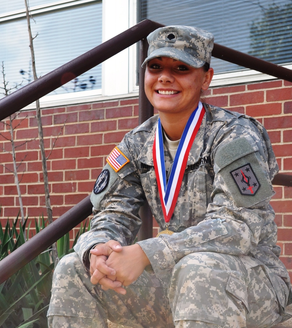 All-Army softball champ poses with Armed Forces Softball Tournament gold medal