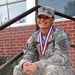 All-Army softball champ poses with Armed Forces Softball Tournament gold medal