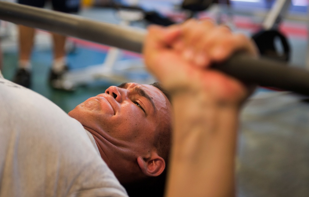 Bench press competition at the wearhouse gym on Naval Air Station North Island.