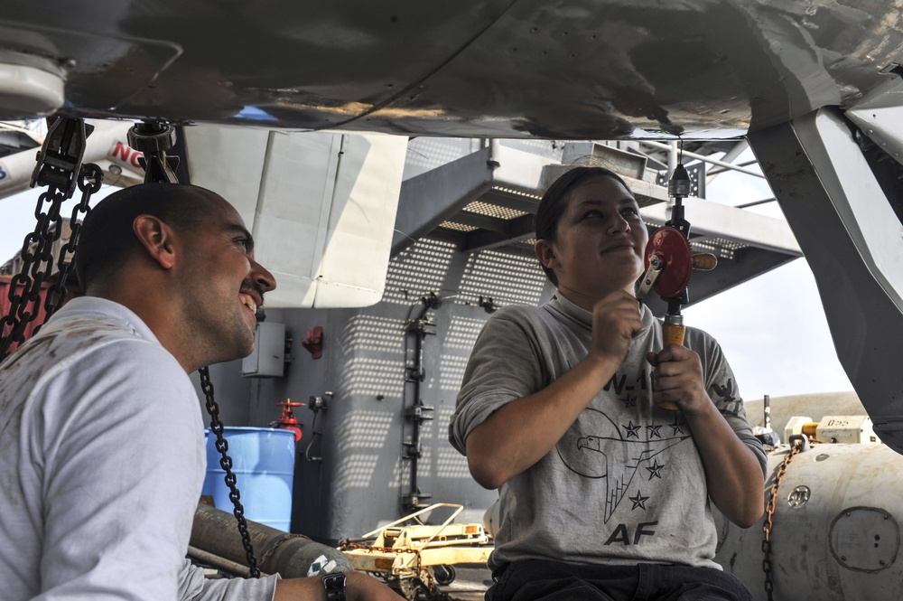 Performing maintenance on an E-2C Hawkeye