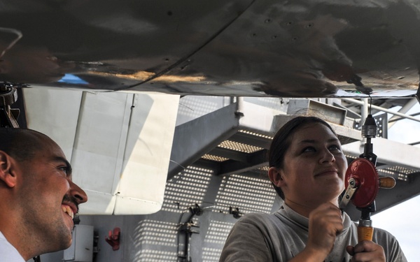 Performing maintenance on an E-2C Hawkeye