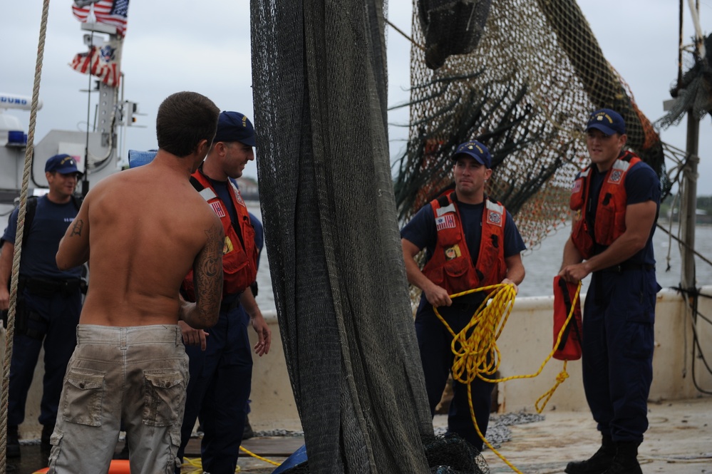 Coast Guard responds to 4 people on flooding boat