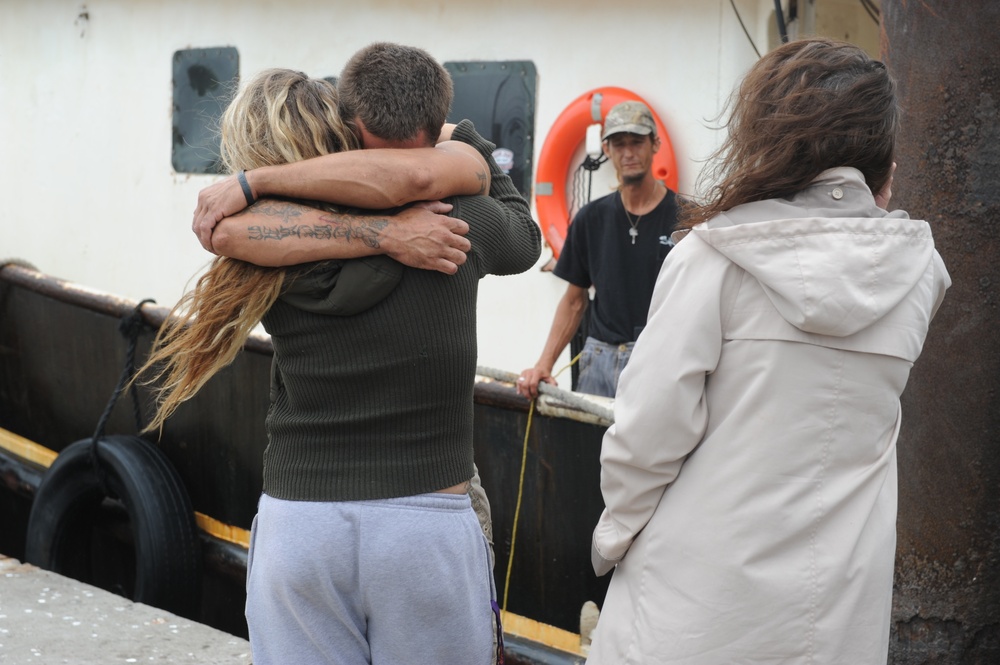 Coast Guard responds to 4 people on flooding boat