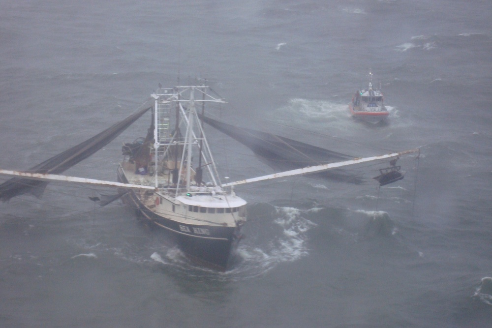 Coast Guard responds to 4 people on flooding boat