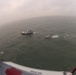 Coast Guard responds to 4 people on flooding boat