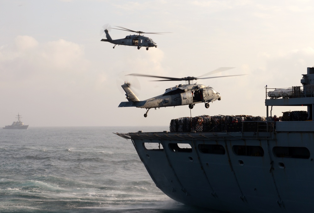 MH-60S Sea Hawk helicopters prepare to lift cargo
