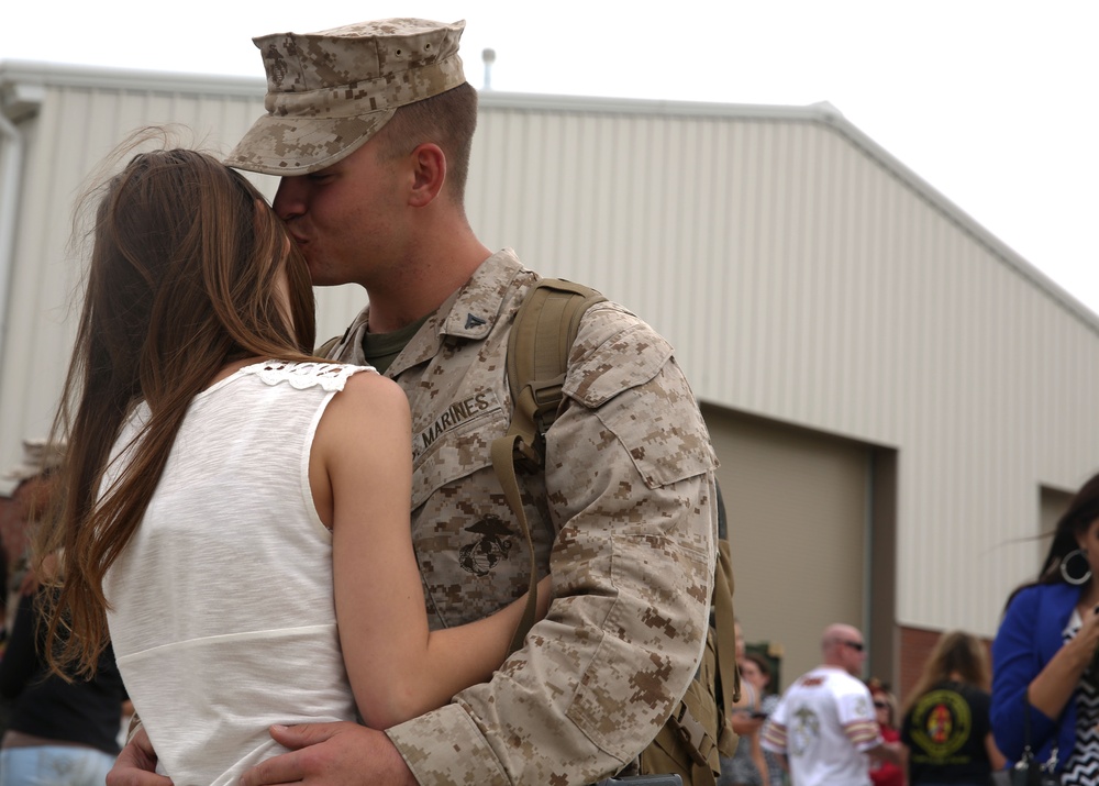Marines embrace their friends and families after a long deployment