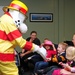 Firefighters pass the torch during Fire Prevention Week