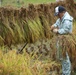 Station residents take time to harvest rice