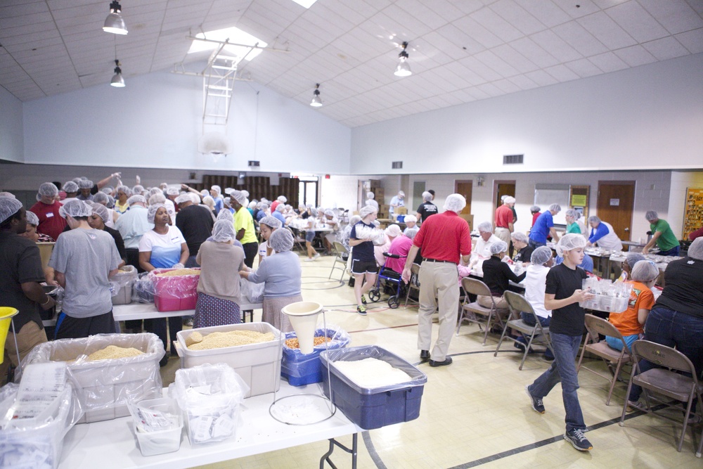 Serving Country and Community: Marines volunteer to package crisis relief meals at Aurora United Methodist Church
