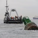 Coast Guard, Navy remove buoy from beach