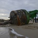Coast Guard, Navy removes buoy from beach