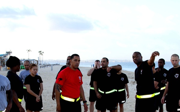 Headquarters and Headquarters Company, 10th Regional Support Group Soldiers enjoy a competitive day at the beach